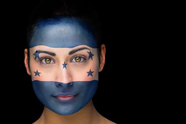 Imagem composta de fã de futebol honduras em pintura facial — Fotografia de Stock