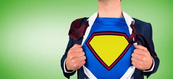 Businessman opening shirt in superhero style — Stock Photo, Image