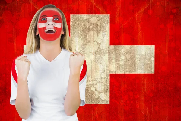 Excited fan in swiss face paint — Stock Photo, Image