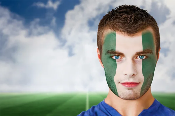 Nigeria football fan in face paint — Stock Photo, Image