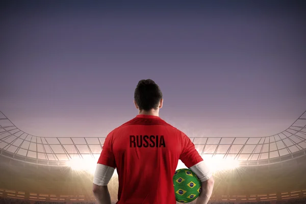 Composite image of russia football player holding ball — Stock Photo, Image