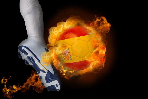 Football player kicking flaming spain ball — Stock Photo, Image