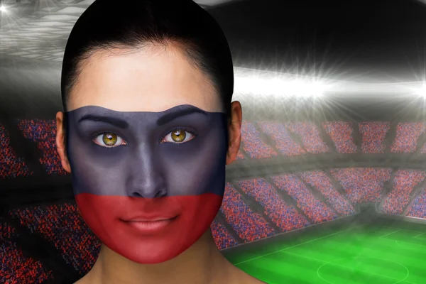 Composite image of beautiful russia fan in face paint — Stock Photo, Image