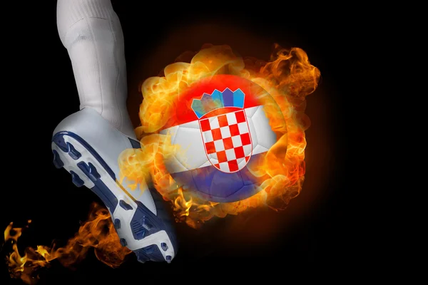 Football player kicking flaming croatia ball — Stock Photo, Image