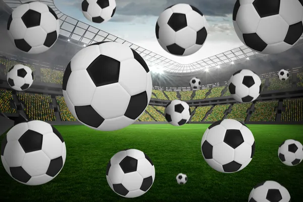 Composite image of black and white footballs — Stock Photo, Image