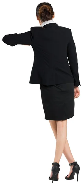 Young businesswoman standing and leaning — Stock Photo, Image