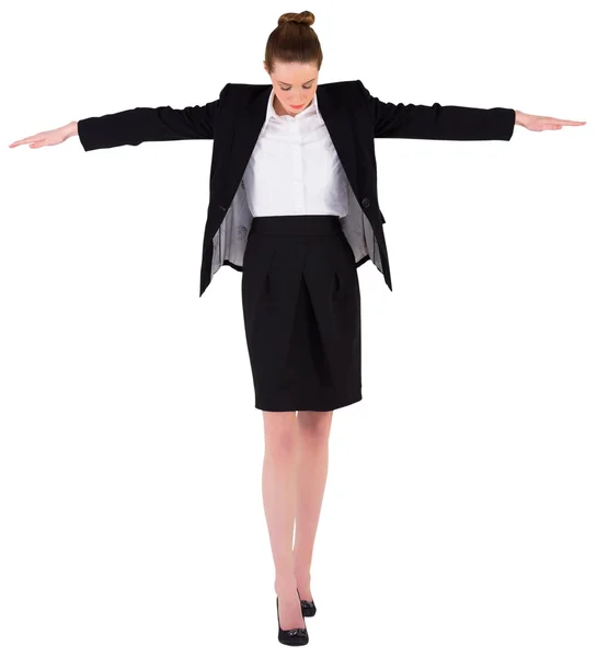 Businesswoman performing a balancing act — Stock Photo, Image