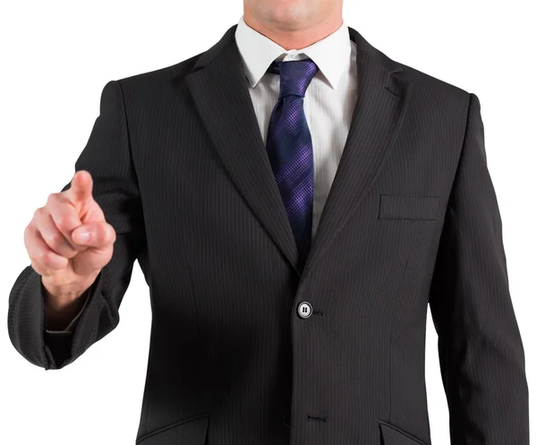 Businessman in suit standing and pointing — Stock Photo, Image