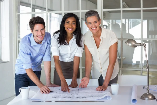 Architects working on blueprints — Stock Photo, Image