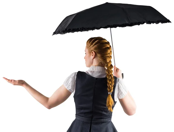 Businesswoman holding umbrella — Stock Photo, Image