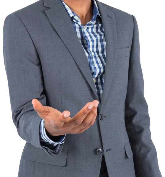 Businessman holding hand out — Stock Photo, Image