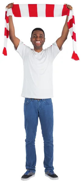 Happy football fan waving scarf — Stock Photo, Image