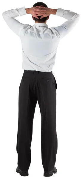 Businessman standing back to the camera with hands on head — Stock Photo, Image
