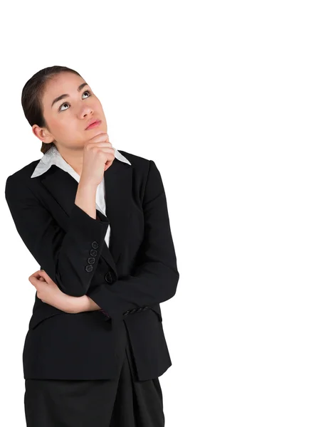 Businesswoman thinking with hand on chin — Stock Photo, Image