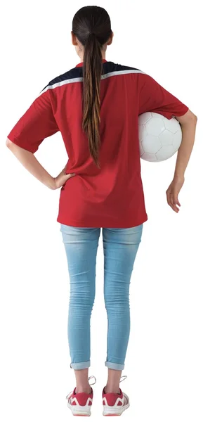 Fotbollsfan i röda innehav boll — Stockfoto