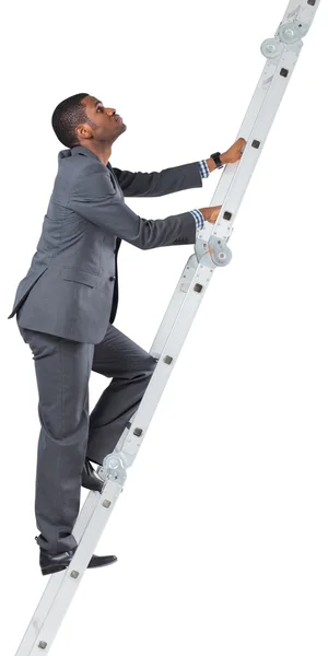 Businessman climbing up ladder — Stock Photo, Image