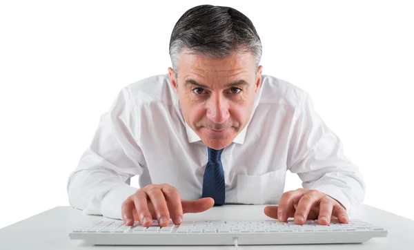 Mature businessman typing on keyboard — Stock Photo, Image