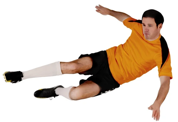 Piłkarz w orange skoki — Zdjęcie stockowe