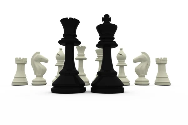 Black king and queen standing in front of white pieces — Stock Photo, Image