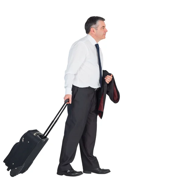 Maturo uomo d'affari tirando la sua valigia — Foto Stock