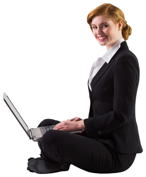 Redhead businesswoman using her laptop — Stock Photo, Image