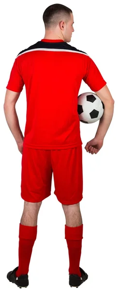 Fotbalový hráč držící míč — Stock fotografie