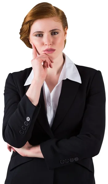 Thinking redhead businesswoman in suit — Stock Photo, Image