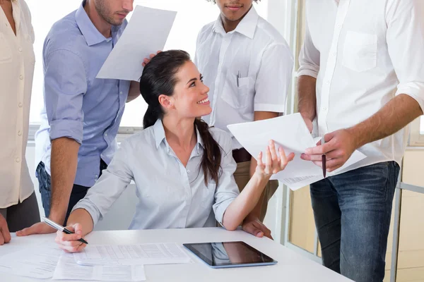 Businesswoman working with businessmen — Stock Photo, Image