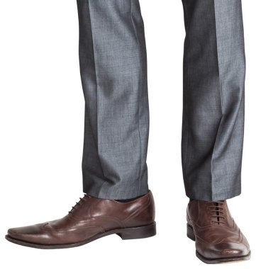 Businessmans feet in brown brogues clipart