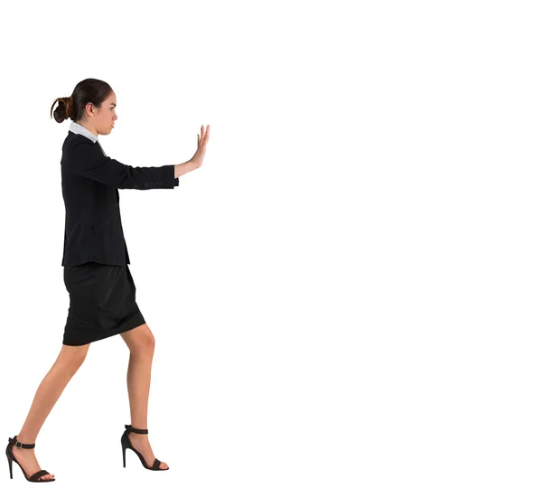 Businesswoman in suit standing and pushing — Stock Photo, Image