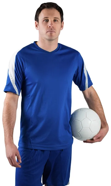 Bonito jogador de futebol segurando a bola — Fotografia de Stock