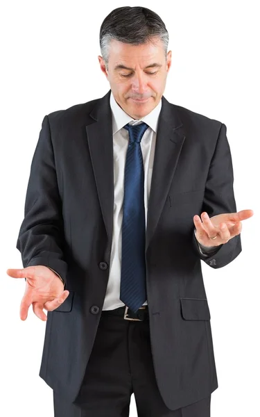 Mature businessman holding his hands out — Stock Photo, Image