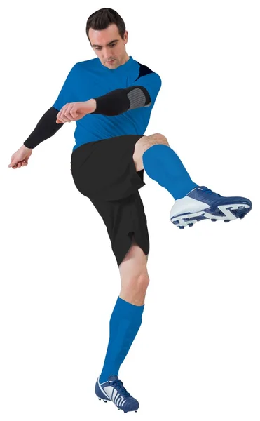 Football player in blue kicking — Stock Photo, Image