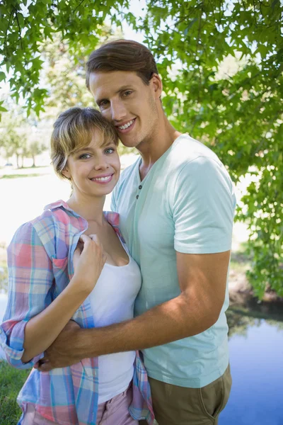 Couple standing together in the park — Stock Photo, Image