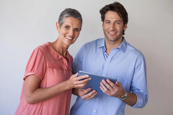 Business team looking at tablet pc — Stock Photo, Image