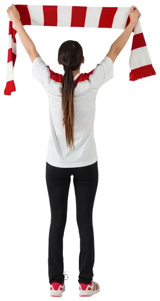 Fan waving red and white scarf — Stock Photo, Image