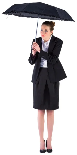 Businesswoman holding a black umbrella — Stock Photo, Image