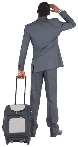 Jonge zakenman met koffer — Stockfoto