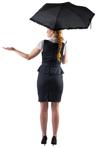 Businesswoman holding umbrella — Stock Photo, Image