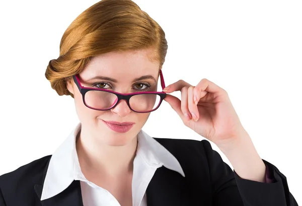 Redhead businesswoman touching her glasses — Stock Photo, Image