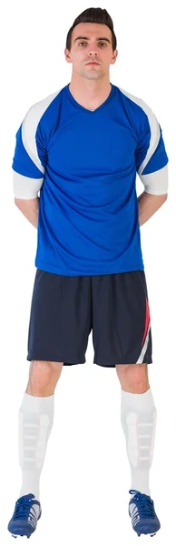 Guapo jugador de fútbol en jersey azul — Foto de Stock