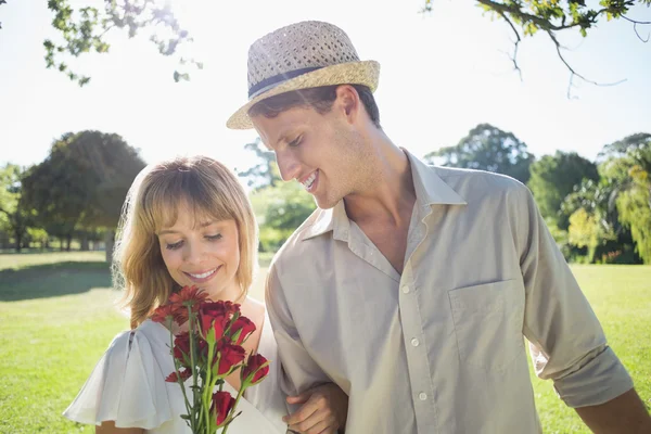 Blonde holding roses with partner — Stock Photo, Image