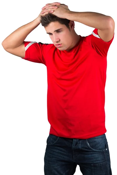赤で失望したフットボールのファン — ストック写真