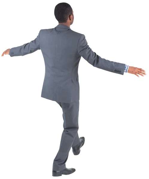 Businessman performing a balancing act — Stock Photo, Image