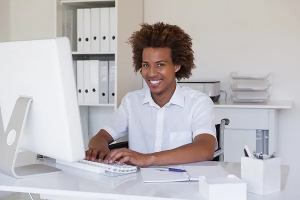 Businessman in wheelchair working at his desk — Stock Photo, Image