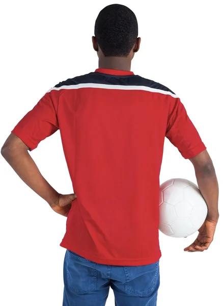 Voetbalfan in rode bedrijf bal — Stockfoto