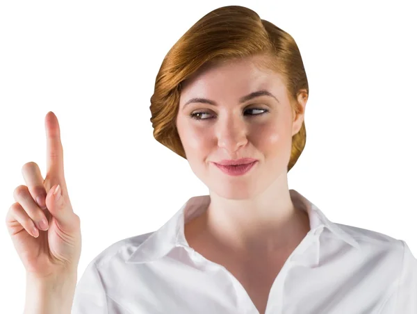 Businesswoman smiling and pointing — Stock Photo, Image
