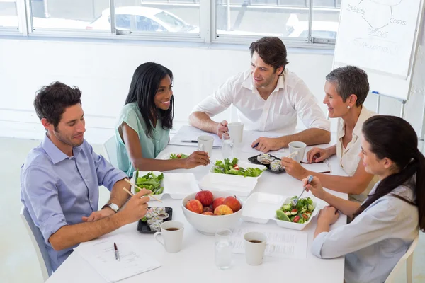 Business people eating lunch together