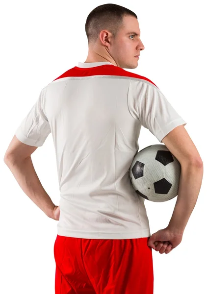 Jogador de futebol segurando a bola — Fotografia de Stock