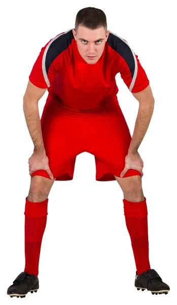 Tired football player bending over — Stock Photo, Image